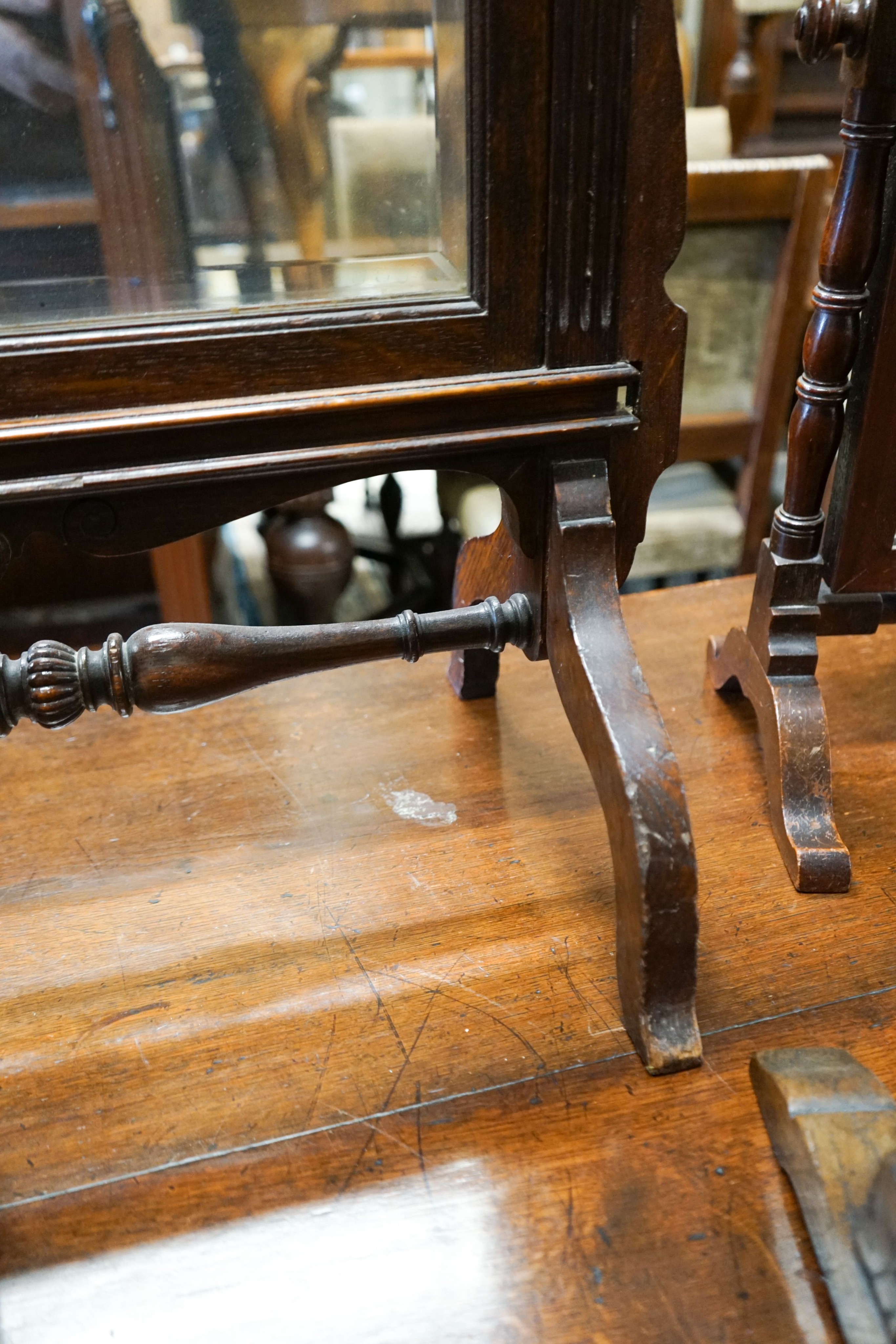 An oak triple mirror, a towel rail, an oak firescreen and two toilet mirrors